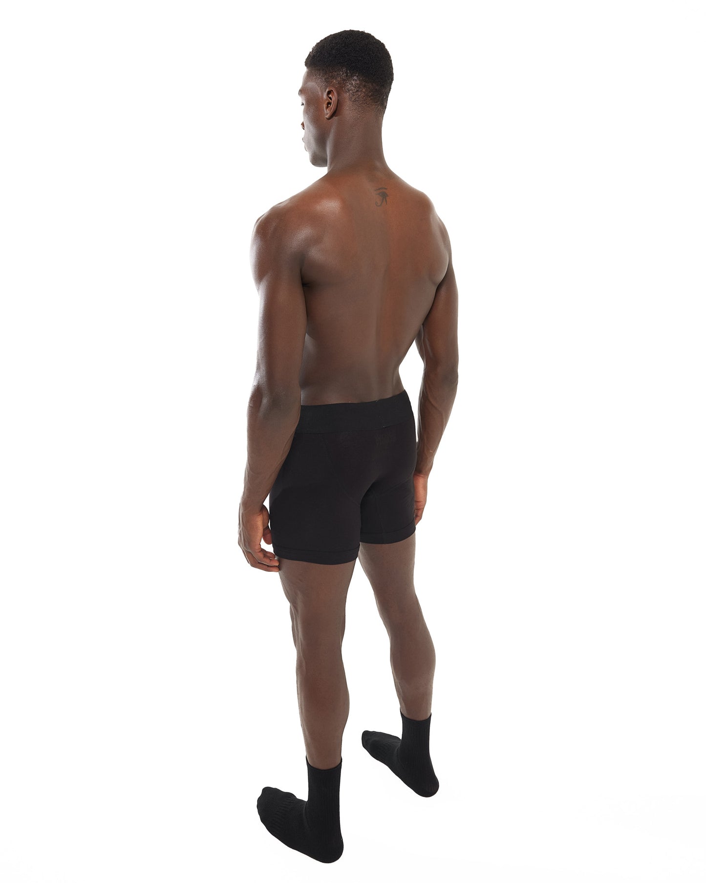 Side view of male model wearing Snow Bunny Boxer Briefs in black